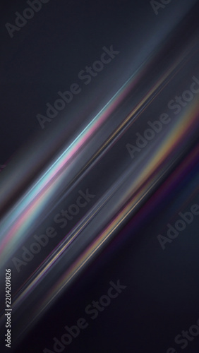 Iridescent rainbow light streaks in diagonal motion on dark background