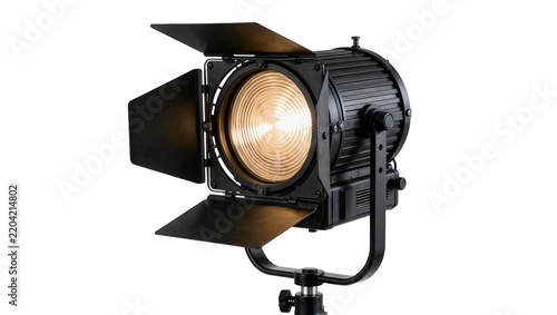 Fotografie Black fresnel spotlight with barn doors and warm light, isolated on transparent