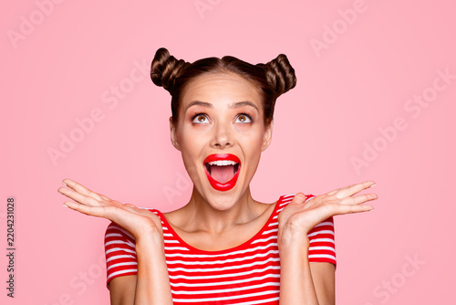 So excited and positive girl isolated on red background loud laughs raising her head and hands up. Concept of advertising, sale and discount isolated on red background