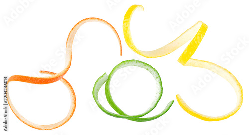 Set of citrus fruit skin slices isolated on a white background. Orange, lime and lemon twist.