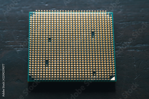 Close Up of a Computer CPU Processor with Gold Pins Facing Up: Hardware and Technology Concept
