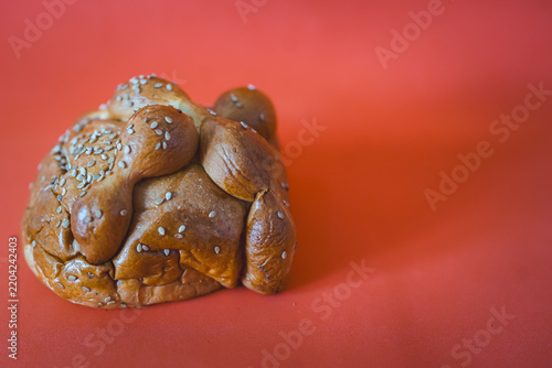 Pan de Muerto with sesame seeds celebrating Day of the Dead