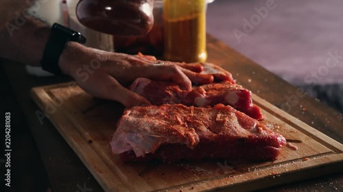 Hand Arranging Seasoned Pork Belly Pieces