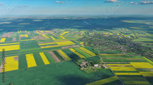 Agricultural fields with yellow rapeseed oil crops