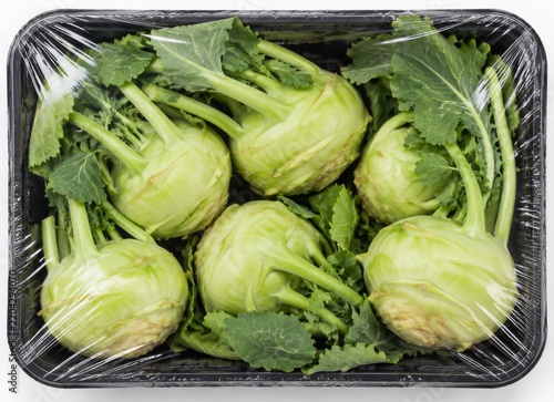 Kohlrabi With Leaves in a Plastic Container