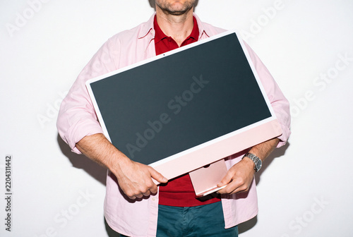 Man Carrying Pink Desktop Computer
