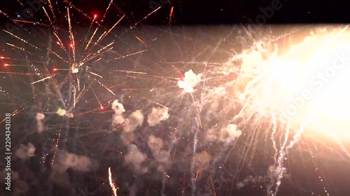 Colorful fireworks exploding in the night sky during a celebration