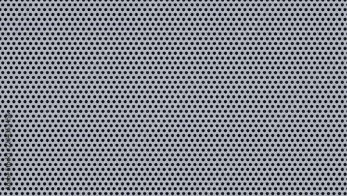 Industrial metal background with circular holes for perforated steel plate grill designs.