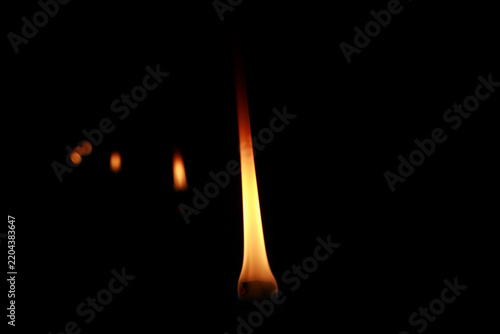burning fire torch on black background