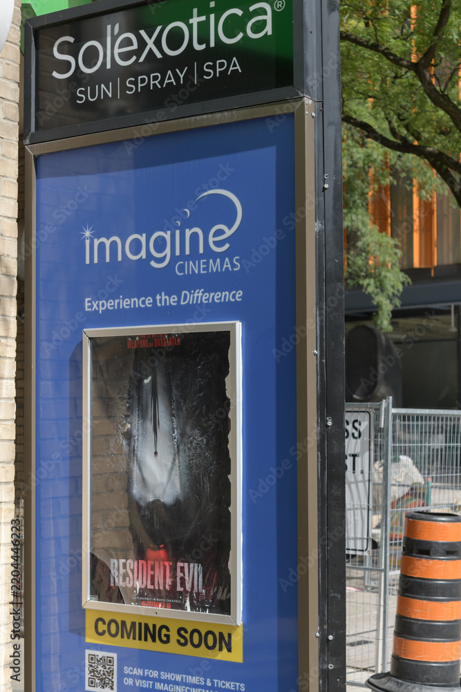 Obraz premium sign outside Imagine Cinemas Market Square a movie theatre located at 80 Front St E, Toronto (Sol’exotica, tanning salon)
