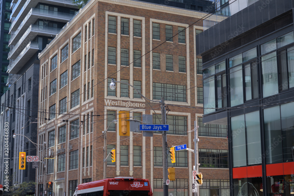 Fototapeta premium former Canadian Westinghouse Building at 355 King St W, now the Sutton Place Hotel, with historic Westinghouse façade incorporated into the King Blue Developments, Toronto