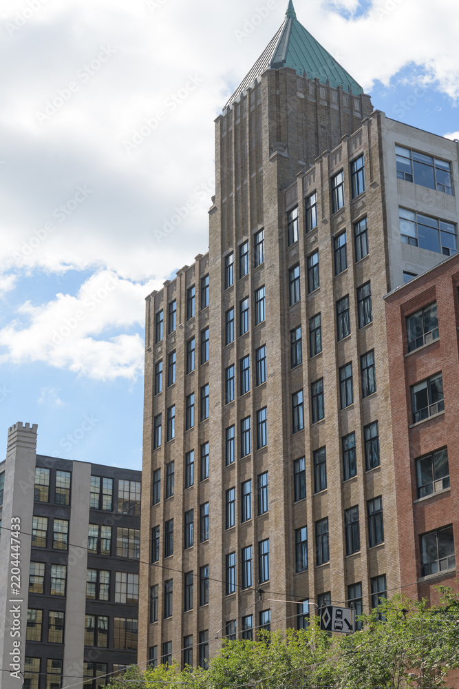 Obraz premium roofline and pyramidal tower at Tower Building designed by Benjamin Brown in Art Deco style located at 110 Spadina Av Garment District, Toronto