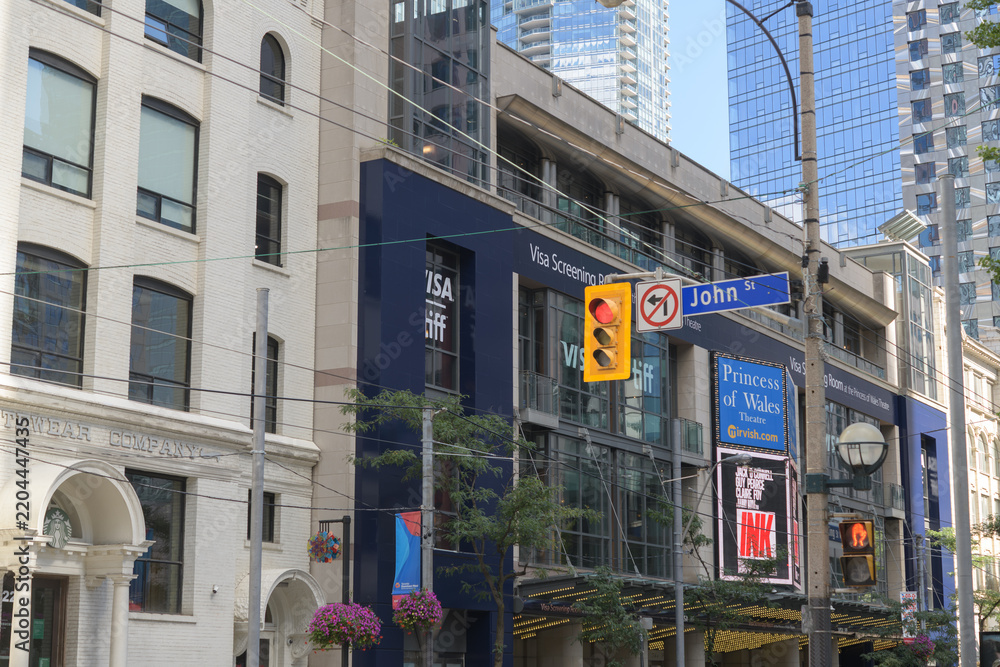 Obraz premium wide view of the historic Eclipse Whitewear Building and Princess of Wales Theatre during TIFF, 300 King St W, Toronto