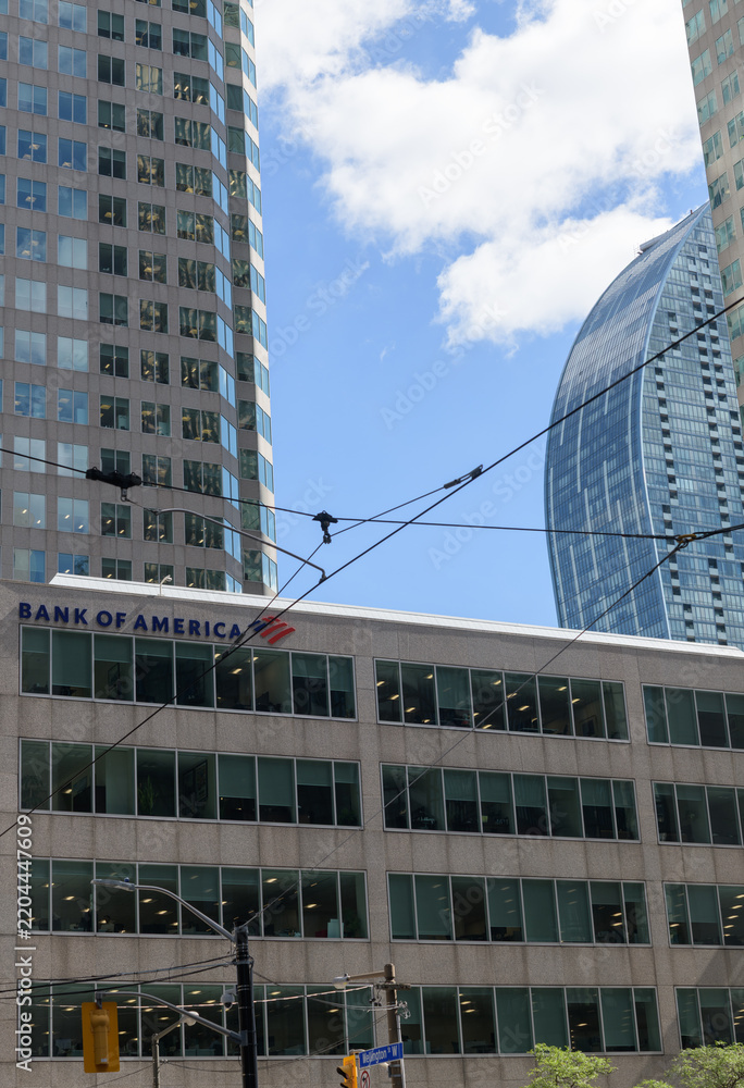 Obraz premium BofA Securities or Bank of America sign on the exterior of Brookfield Place, 161 Bay St with view of L Tower condo, Toronto