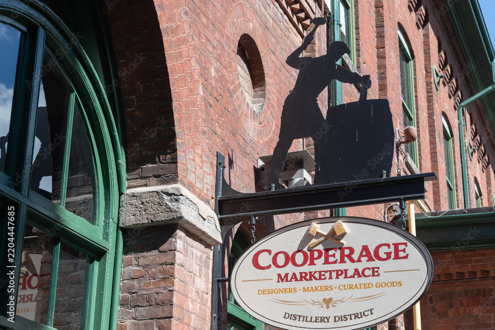 Obraz premium wall-mounted blade sign outside The Cooperage Marketplace located at 52 Gristmill Lane, Distillery District, Toronto