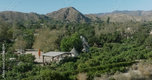 Aerial View of Wooded Neighborhood Below Hills