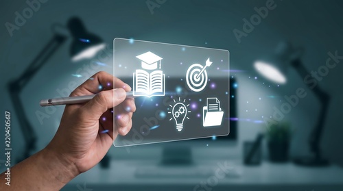 Hand interacting with glowing digital educational interface icons in office setting