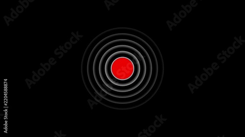Concentric grey rings emanate from a central bright red circle against a black background, creating a visual representation of a signal, target, or alert with a strong, focused impact