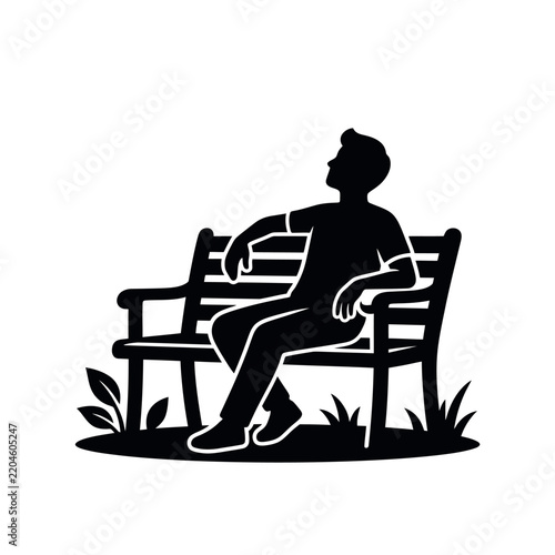 Silhouette of a person relaxing on a park bench outdoors.