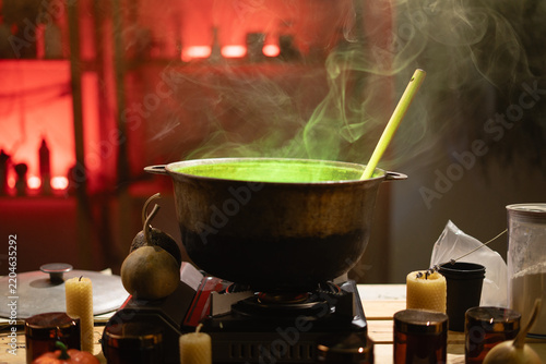 Quadro su tela A close-up of a cauldron on the stove, with green steam rising from it