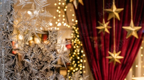 Glowing Christmas tree lights and star decorations