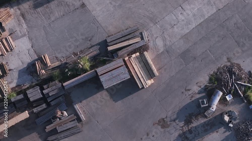 Aerial top-down view of lumber stacks at a woodworking factory