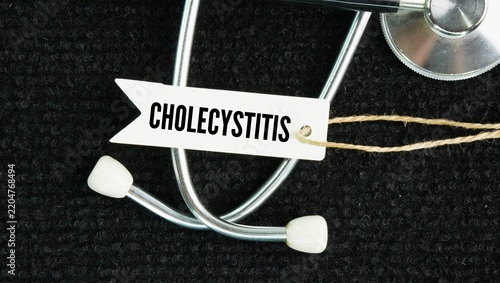 Фотография Stethoscope and paper tag with the word Cholecystitis is the inflammation and sw
