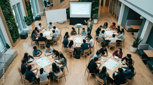 Diverse team of professionals collaborating in modern corporate boardroom training seminar