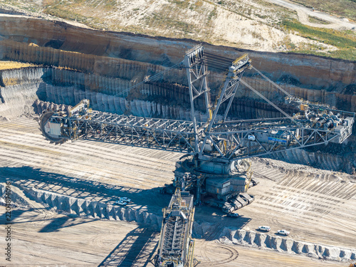 Aerial view of the massive bucket-wheel excavator at the Tagebau Welzow-Sud open-pit mine, showing industrial machinery and deep excavation layers in Spremberg, Brandenburg, Germany.