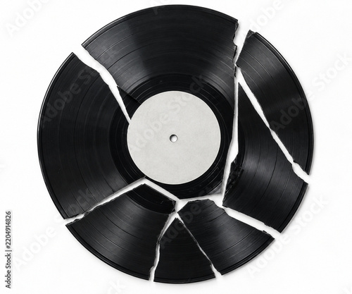 Broken Black Vinyl Record Shattered into Pieces with Blank White Label Isolated on White Background