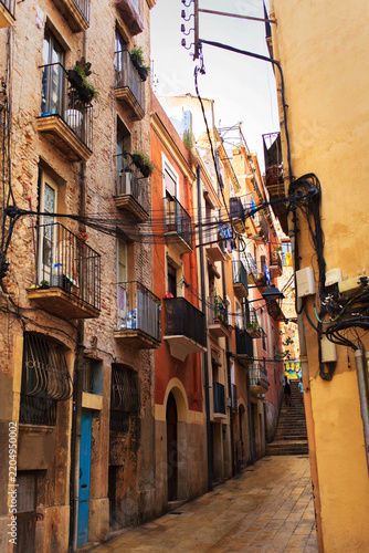 Picturesque view of a narrow street in Tarragona city, Spain