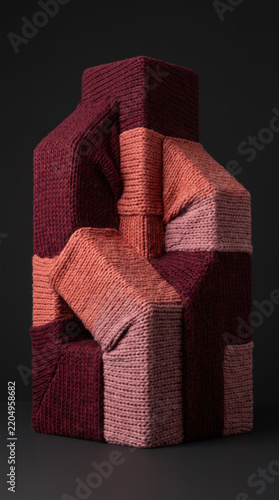 Sculptural stack of knitted geometric forms.