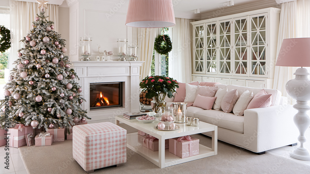 Obraz premium Elegant living room interior featuring a beautiful Christmas tree, comfortable sofa, glowing fireplace, and holiday decorations