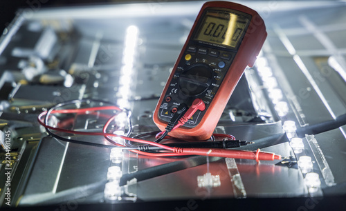 Naklejka Digital Multimeter Testing Electronics Inside Disassembled LED Screen