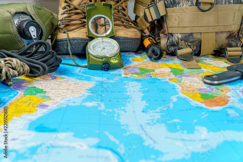 Fotografie Exploring destinations with essential equipment, compass, hiking boots, backpack