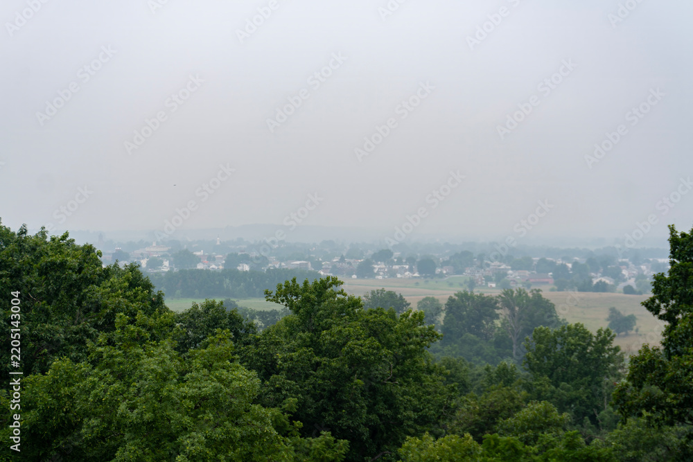 Fototapeta premium Travel and History: Panoramic View of Gettysburg Town and Battlefield Landscape from Culp's Hill Observation Tower in Pennsylvania