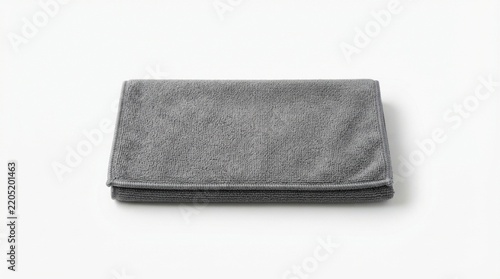 Folded grey microfiber towel photo isolated on white background