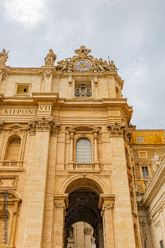 Architectural detail of the ornate facade and entrance of Saint Peter's Basilica, Vatican City
