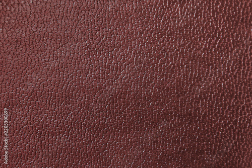 Burgundy leather texture with fine grain as background