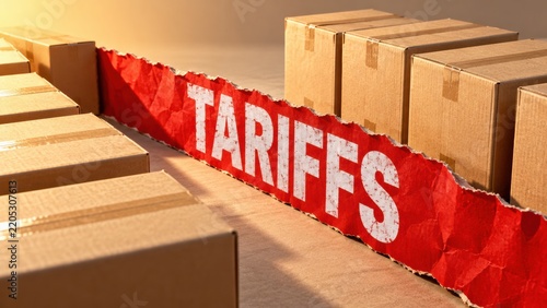 Cardboard boxes separated by torn paper with tariffs text