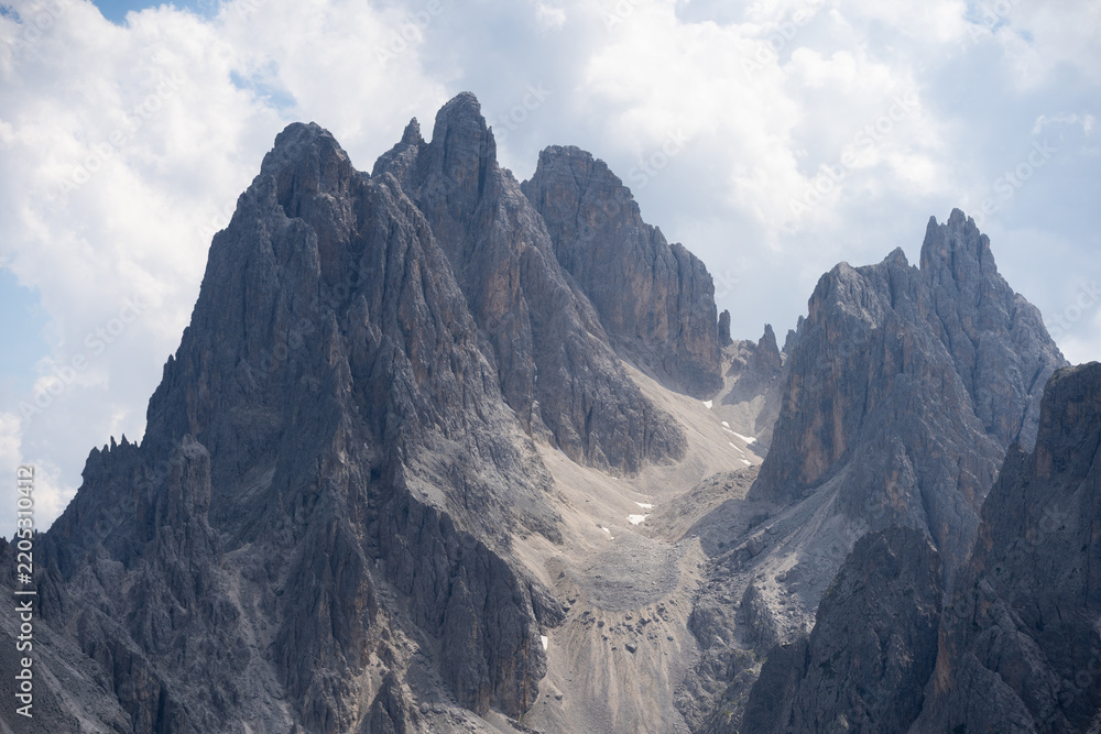 Obraz premium Mountain landscape panorama Tre Cime Mount against a blue summer background. 