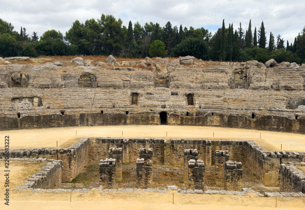 Obraz premium The arena in the amphitheater of Italica, an archaeological site at the outskirts of Seville 