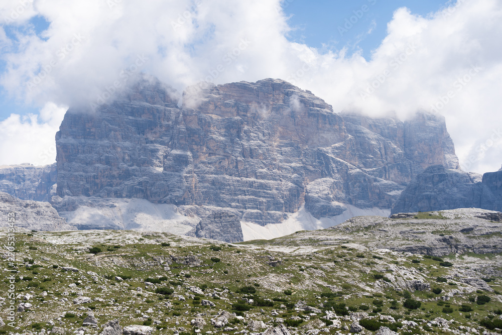 Obraz premium Mountain landscape panorama Tre Cime Mount against a blue summer background. 