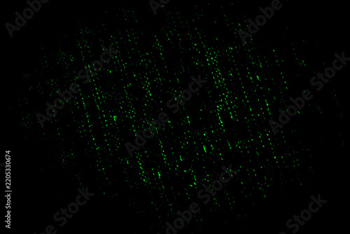 Intense black background with specs of woven lime green spots. 