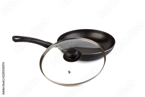 New Non-Stick Frying Pan with Clear Glass Lid Resting Beside Handle