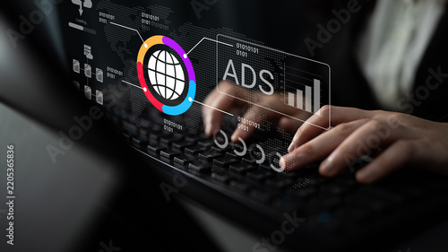 A professional typing on a keyboard while engaging with digital marketing analytics and global advertising concepts, showcasing modern business technology and strategy. Nascent