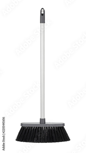 Plastic floor broom with a long metallic handle and durable black bristles designed for household cleaning tasks shown 