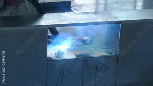 Welding torch melting metal seam on thick steel workpiece