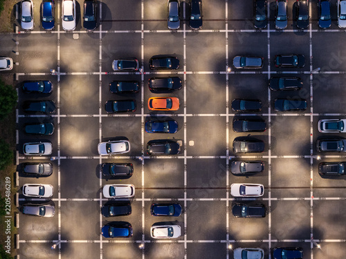 Aerial view of Audi Zentrum Berlin Adlershof parking lot filled with various cars including a bright orange vehicle parked in marked spaces Berlin, Berlin, Germany.