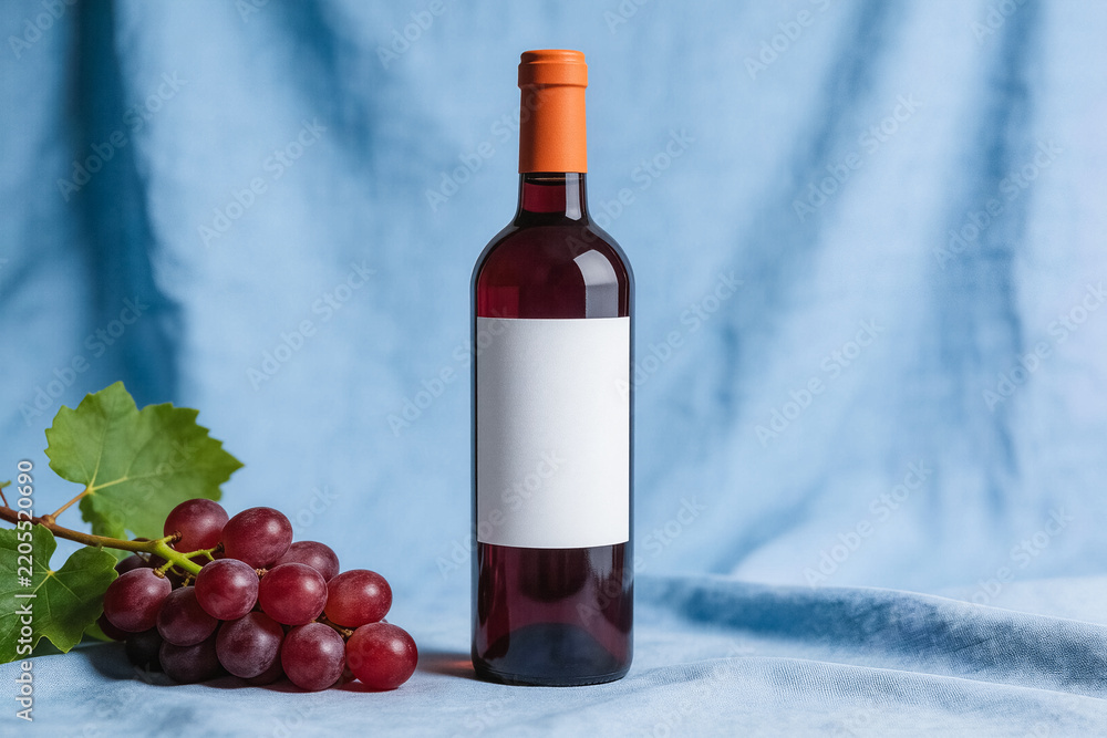 Obraz premium Red Wine Bottle with Blank Label and Fresh Grape Cluster